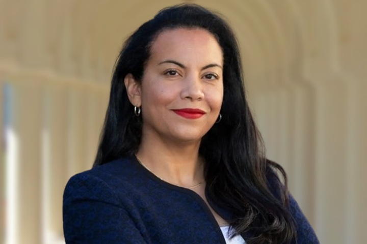 Analilia Mejia speaking at a community event in NJ-11